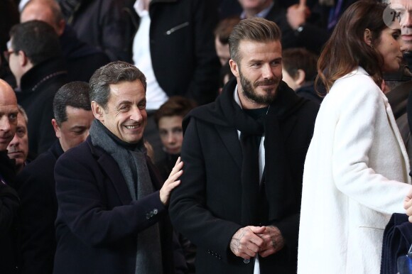 David Beckham et Nicolas Sarkozy lors du match de ligue de champions entre le PSG et Chelsea, au Parc des Princes à Paris le 17 février 2015