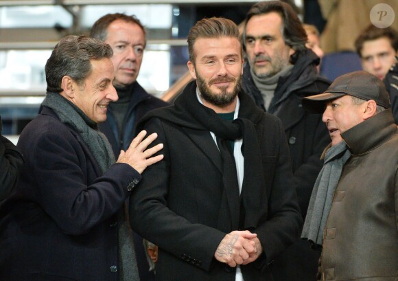 Nicolas Sarkozy et David Beckham lors du match de ligue de champions entre le PSG et Chelsea, au Parc des Princes à Paris le 17 février 2015