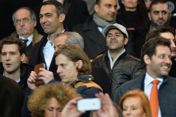 Youri Djorkaeff, Jamel Debbouze et Pierre Sarkozy lors du match de ligue de champions entre le PSG et Chelsea, au Parc des Princes à Paris le 17 février 2015