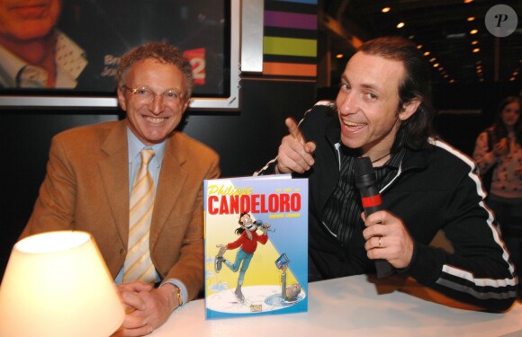 Nelson Monfort et Philippe Candeloro au Salon du Livre à la Porte de Versailles à Paris, le 18 mars 2008