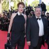 Natacha Polony (habillée en Karl Lagerfeld) et son mari Perico Légasse - Montée des marches du film "Pour une poignée de dollars" pour la cérémonie de clôture du 67e festival du film de Cannes. Le 24 mai 2014.