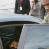 Exclusif - Kanye West installe sa fille North à l'arrière de sa Porsche Panamera. Paris, le 4 mars 2015.