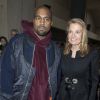 Kanye West et Jane Hartley, ambassadrice des États-Unis en France, assistent au défilé Céline automne-hiver 2015-2016, au Tennis Club de Paris, le 8 mars 2015.