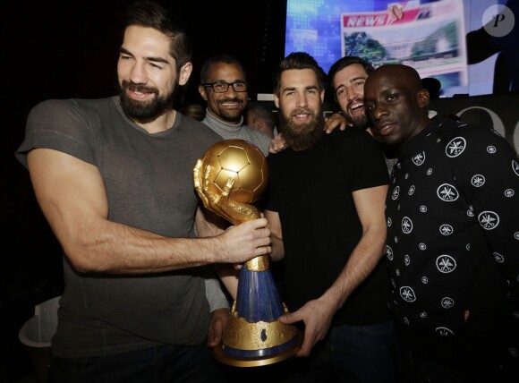 Nikola Karabatic, Didier Dinart, Luka Karabatic, Frédéric Dumoulin et Kevynn Nyokas au Vip Room pour célébrer leur titre de champion du monde, à Paris le 2 février 2015