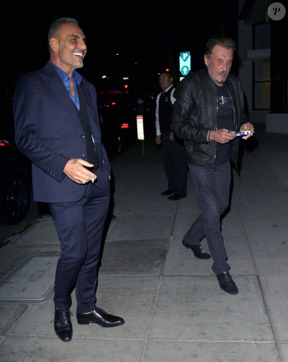 Johnny Hallyday et Christian Audigier lors d'un dîner au restaurant Mr Chow à Los Angeles le 23 janvier 2015