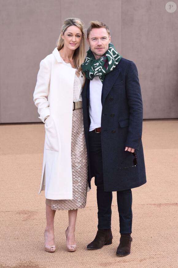 Ronan Keating et Storm Uechtritz lors du défilé Burberry Prorsum lors de la Fashion Week de Londres, le 23 février 2015