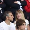Nagui et sa femme Mélanie Page lors de la rencontre entre le Paris Saint-Germain et le FC Barcelone en quart de finale de la Ligue des champions, le 15 avril 2015 au Parc des Princes à Paris