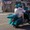 Exclusif - Miley Cyrus monte derrière un inconnu sur sa moto Harley Davidson pour profiter d'une escapade colorée avec un casque assorti avant de continuer la route avec ses amis dans leur Porsche décapotable à Hollywood, le 12 avril 2015.