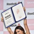 Miranda Kerr fait la promotion des nouvelles baskets Reebok Skyscape au centre commercial Omotesando Hills à Tokyo, le 15 avril 2015.