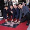 Le groupe New Kids on the Block (ou NKOTB), composé de Donnie Wahlberg, Jordan Knight, Jonathan Knight, Joey McIntyre, et Danny Wood, reçoit son étoile sur le Walk Of Fame en compagnie d'Arsenio Hall à Hollywood, le 9 octobre 2014