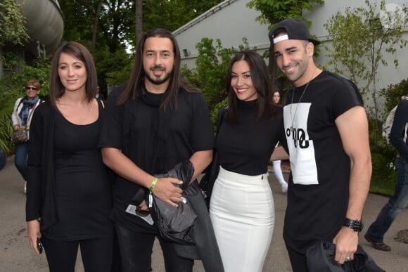 Moundir et Adil Rami et leurs compagnes au second jour des Internationaux de Roland-Garros à Paris, le 25 mai 2015
