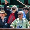 Julie Gayet et Pierre Richard dans les tribunes des Internationaux de Paris à Roland-Garros, à Paris le 4 juin 2015.