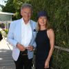 Nelson Monfort et sa femme Dominique aux Internationaux de Paris à Roland-Garros, à Paris le 4 juin 2015.