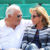 Dominique Strauss Kahn et sa compagne Myriam L'Aouffir dans les tribunes des Internationaux de France de tennis de Roland-Garros le 30 mai 2015.