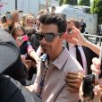 Joe Jonas lors du d&eacute;fil&eacute; Louis Vuitton (collection homme printemps-&eacute;t&eacute; 2016) au Parc Andre-Citro&euml;n. Paris, le 25 juin 2015. 