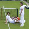 Amélie Mauresmo, enceinte, lors d'un entraînement avec Andy Murray et Jonas Björkman au All England Lawn Tennis and Croquet Club de Wimbledon, à Londres, le 24 juin 2015