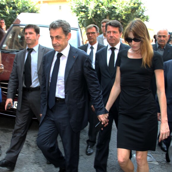 Nicolas Sarkozy et son épouse Carla Bruni-Sarkozy lors des obsèques de Charles Pasqua en la cathédrale Notre-Dame du Puy à Grasse, le 7 juillet 2015