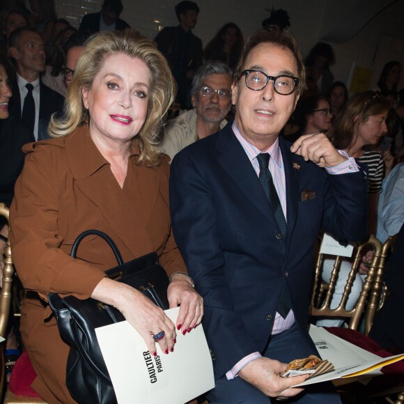 Catherine Deneuve et Gilles Dufour assistent au défilé Jean Paul Gaultier (collection haute couture automne-hiver 2015/2016) au 325, rue Saint Martin. Paris, le 8 juillet 2015.