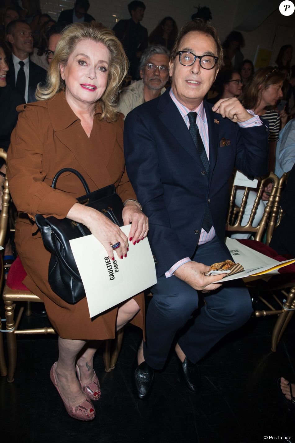 Catherine Deneuve et Gilles Dufour assistent au défilé Jean Paul