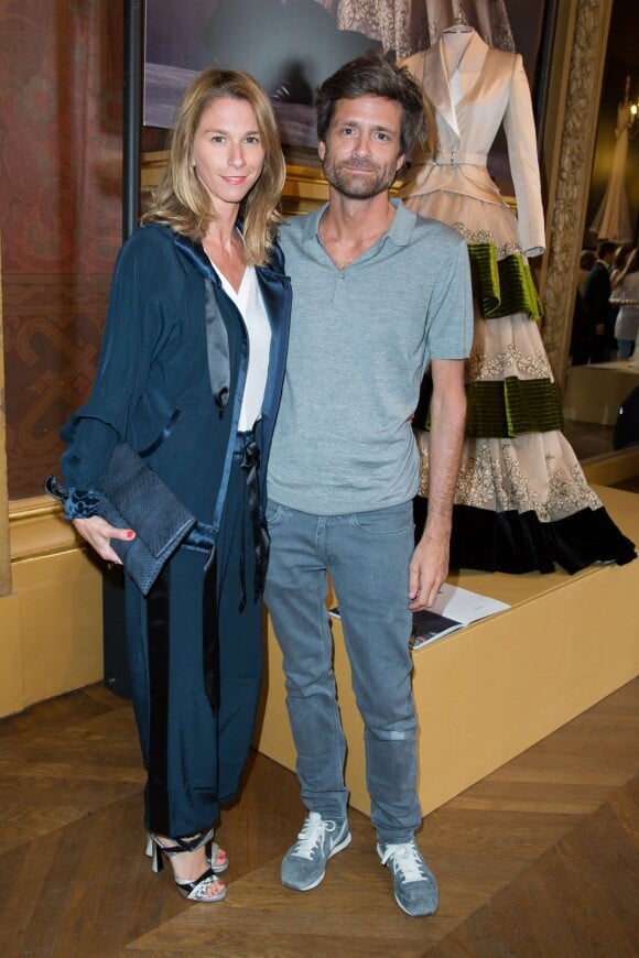 Joseph Dirand et sa compagne Anne-Sophie Bilet assistent à la présentation d'Alexis Mabille (collection haute couture automne-hiver 2015-2016) au Palais Garnier. Paris, le 8 juillet 2015.