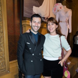 Alexis Mabille et Cécile Togni assistent à la présentation de la collection haute couture automne-hiver 2015-2016 du créateur, au Palais Garnier. Paris, le 8 juillet 2015.