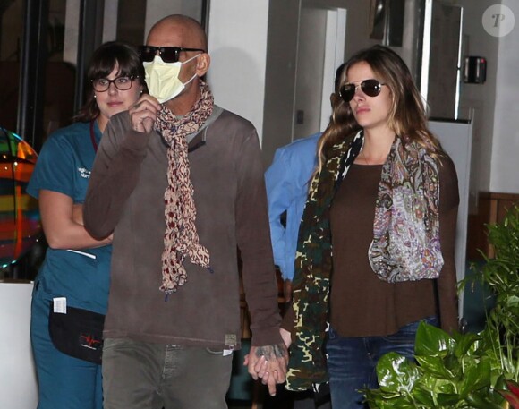 Exclusif -  Atteint d'un cancer, Christian Audigier, le styliste français made in Hollywood quitte l'hôpital Cedar Sinaï avec sa femme Nathalie Sorensen à Los Angeles le 6 avril 2015.