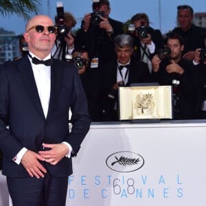 Jacques Audiard (Palme d'Or pour le film "Dheepan") - Photocall de la remise des palmes du 68e Festival du film de Cannes,  le 24 mai 2014. 