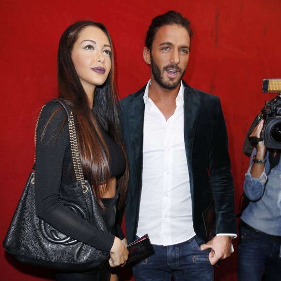 Nabilla Benattia et son petit ami Thomas Vergara au défilé de mode Jean Paul Gaultier à Paris, le 28 septembre 2013.