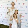 Malgré la perte définitive de la garde de ses enfants, qu'elle a pour tout l'été en vacances, l'actrice Kelly Rutherford, son fils Hermes et sa fille Helena ont assisté à l'oeuvre caritative "Ovarian Cancer Research Fund's Super Saturday" à Water Mill. Le 25 juillet 2015