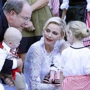 2015/Le prince Albert de Monaco et la princesse Charlène, accompagnés de leurs enfants le prince Jacques et la princesse Gabriella, habillés en costume traditionnel, au pique-nique de la Principauté, qui se tient chaque année au parc de la princesse Antoinette le 28 août 2015.