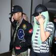 Tyga et sa compagne Kylie Jenner, les cheveux verts, arrivent à l'aéroport LAX de Los Angeles. Le 16 septembre 2015