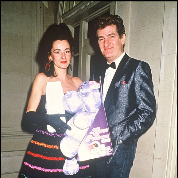 Eddy Mitchell et son épouse Muriel lors d'une soirée organisée par Eddy Barclay, le 21 janvier 1988. 