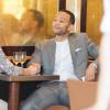 John Legend et sa femme Chrissy Teigen au restaurant place du Trocadéro après le défilé Armani à Paris, le 7 juillet 2015.