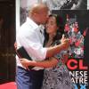 Dwayne Johnson et sa fille Simone Alexandra Johnson - Dwayne Johnson laisse ses empreintes dans le ciment hollywoodien au TCL Chinese Theater à Hollywood, le 19 mai 2015
