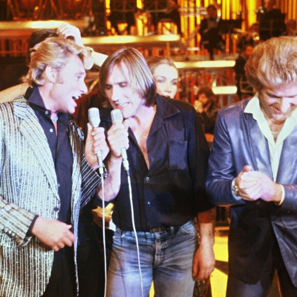 Johnny Hallyday, Gérard Depardieu et Eddy Mitchell sur le plateau de l'émission Palmarès 80 en novembre 1980 à Paris