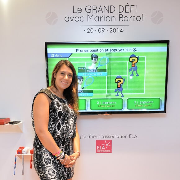 Exclusif - Marion Bartoli défie ses fans à la Wii pour l'association ELA à la boutique Maty, place de l'Opéra à Paris, le 20 septembre 2014