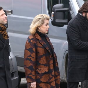 Alex Beaupain et Catherine Deneuve - Obsèques de Michel Delpech en l'église Saint-Sulpice à Paris, le 8 janvier 2016.