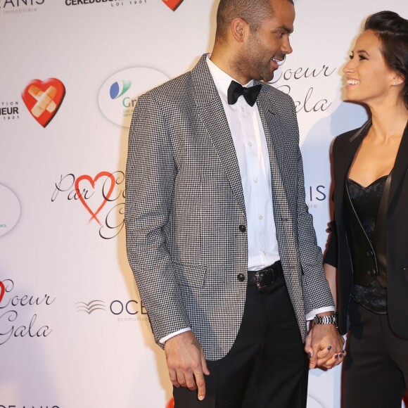 Tony Parker et sa femme Axelle Francine - Personnalités au gala "Par Coeur" pour les 10 ans de l'association "Cekedubonheur" au pavillon d'Armenonville à Paris. Le 24 septembre 2015.