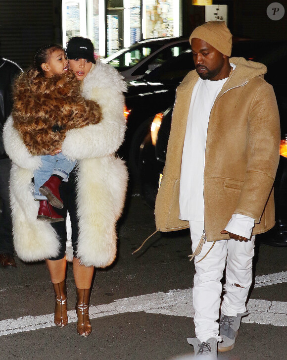 Kim Kardashian, son mari Kanye West et leur fille North à New York, le 14 février 2016.