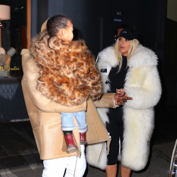 Kim Kardashian, son mari Kanye West et leur fille North à New York, le 14 février 2016.
