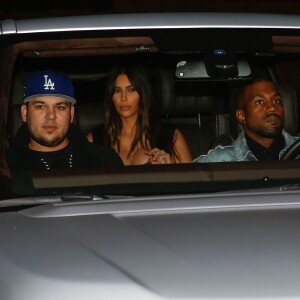 Kim Kardashian, son mari Kanye West et Rob à la soirée d'anniversaire de Rob Kardashian Jr. au restaurant Nobu à Malibu, le 17 mars 2016.