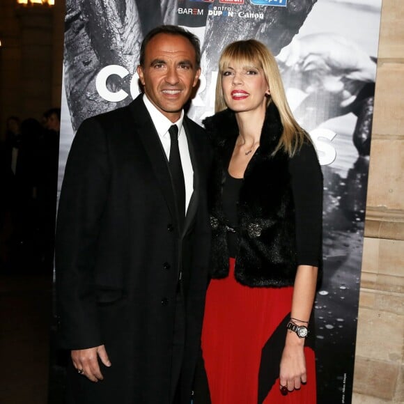 Nikos Aliagas et sa compagne Tina Grigoriou - Inauguration de l'exposition photographique de Nikos Aliagas intitulée "Corps et âmes" à la Conciergerie à Paris le 23 Mars 2016. L'animateur de TF1 présente, dans ce monument historique et révolutionnaire, une facette moins connue de sa personnalité : il expose, en grand format et en noir et blanc, dix clichés très personnels ainsi qu'un diaporama de portraits de personnalités du 24 mars au 22 mai 2016. © Dominique Jacovides / Bestimage