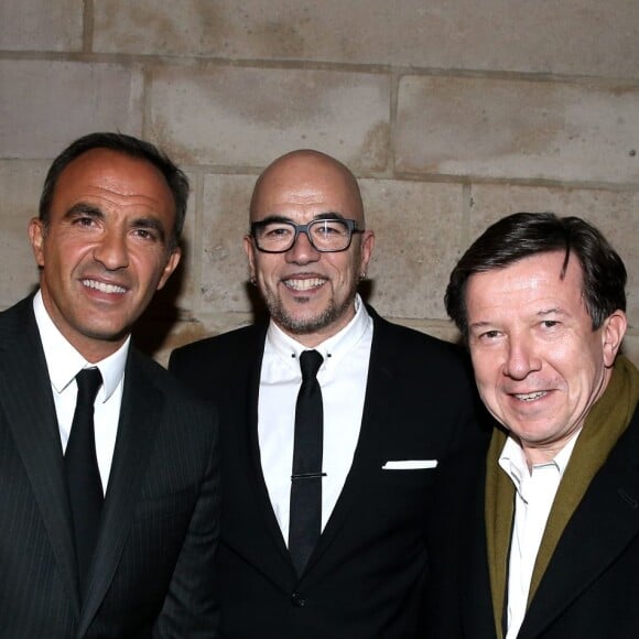 Nikos Aliagas, Pascal Obispo, Gilles Pélisson - Inauguration de l'exposition photographique de Nikos Aliagas intitulée "Corps et âmes" à la Conciergerie à Paris le 23 Mars 2016. L'animateur de TF1 présente, dans ce monument historique et révolutionnaire, une facette moins connue de sa personnalité : il expose, en grand format et en noir et blanc, dix clichés très personnels ainsi qu'un diaporama de portraits de personnalités du 24 mars au 22 mai 2016. © Dominique Jacovides / Bestimage