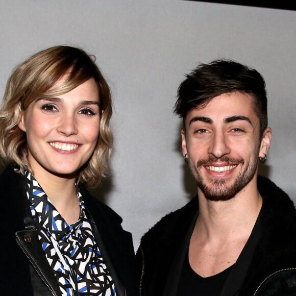 Camille Lou et un ami - Inauguration de l'exposition photographique de Nikos Aliagas intitulée "Corps et âmes" à la Conciergerie à Paris le 23 Mars 2016. L'animateur de TF1 présente, dans ce monument historique et révolutionnaire, une facette moins connue de sa personnalité : il expose, en grand format et en noir et blanc, dix clichés très personnels ainsi qu'un diaporama de portraits de personnalités du 24 mars au 22 mai 2016. © Dominique Jacovides / Bestimage