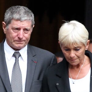 Jean-Michel Larqué et sa femme - Obsèques de Thierry Roland en 2012.