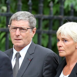 Jean-Michel Larqué et son épouse - Obsèques de Thierry Roland en 2012.