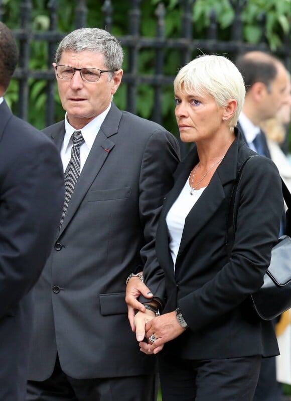 Jean-Michel Larqué et son épouse - Obsèques de Thierry Roland en 2012.