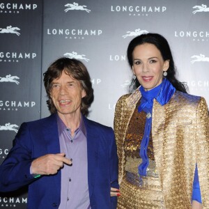 Mick Jagger et L'Wren Scott à l'Inauguration du nouveau flagship Longchamp a Londres, le 14 septembre 2013.