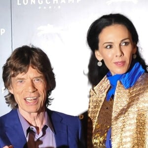 Mick Jagger, L'Wren Scott à la soiree du magazine W a Londres, le 14 septembre 2013.