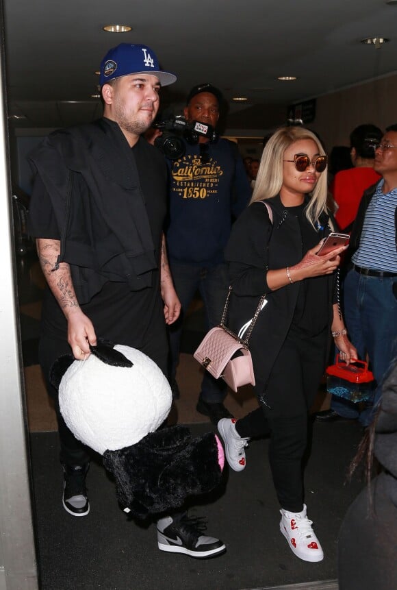 Rob Kardashian et sa compagne Blac Chyna arrivent à l'aéroport LAX de Los Angeles le 27 Mars 2016